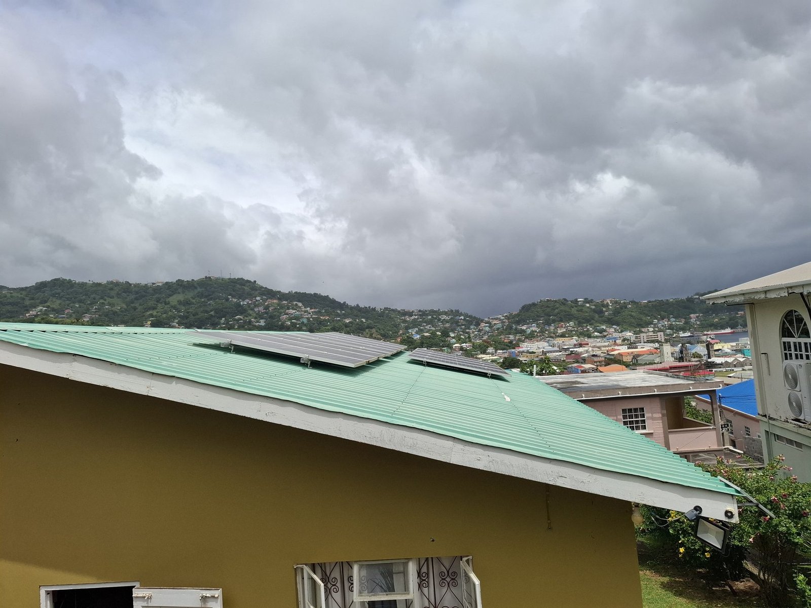 Solar panel array installed on a home roof in St. Vincent and the Grenadines